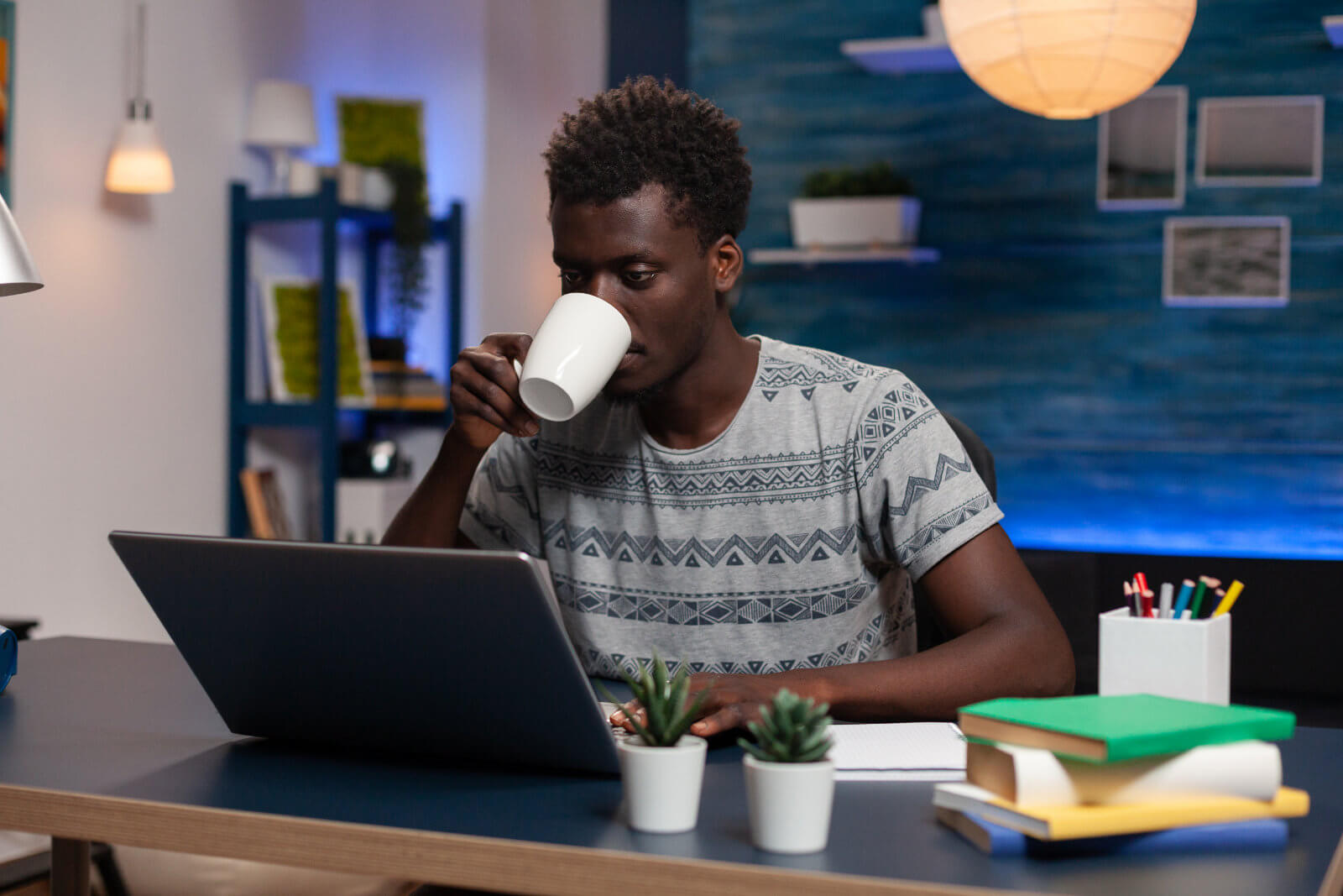 man reading on a computer